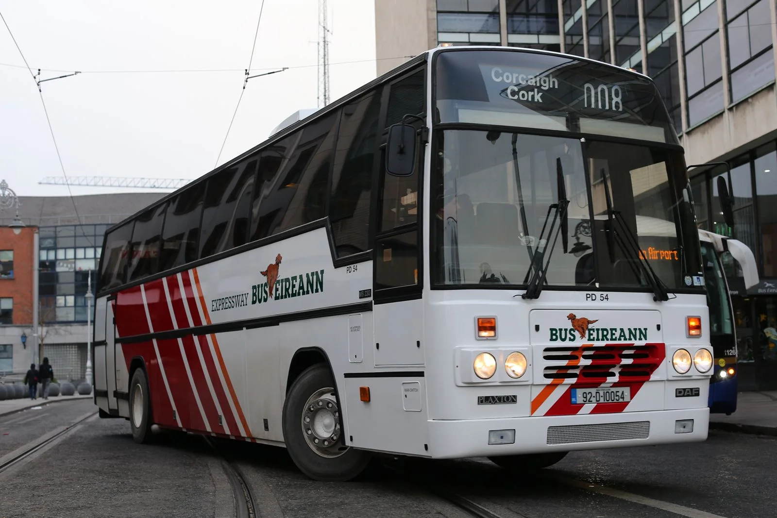 White and red Bus Eireann Expressway coach bound for Cork